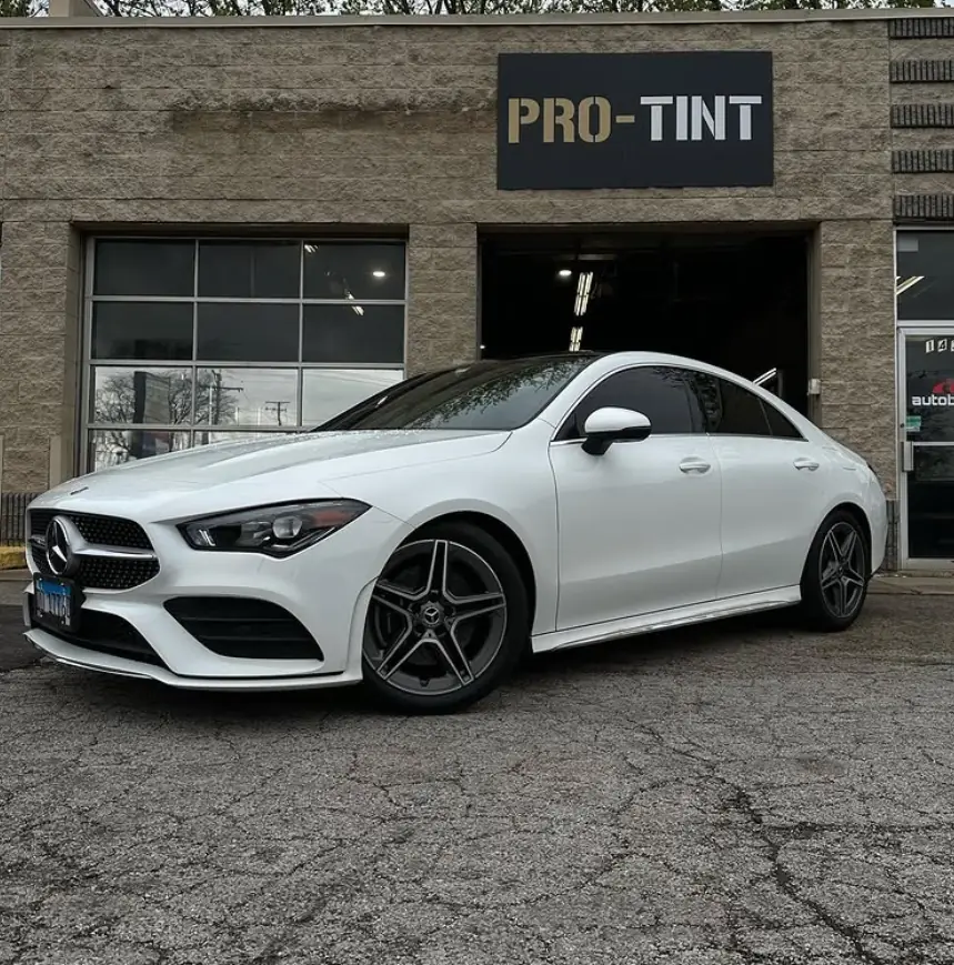 White Mercedes CLA outside Pro-Tint