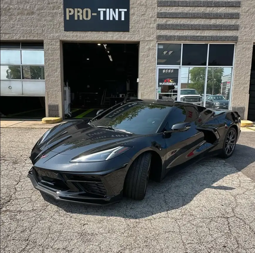 Black Corvette parked outside Pro-Tint on Rand Road