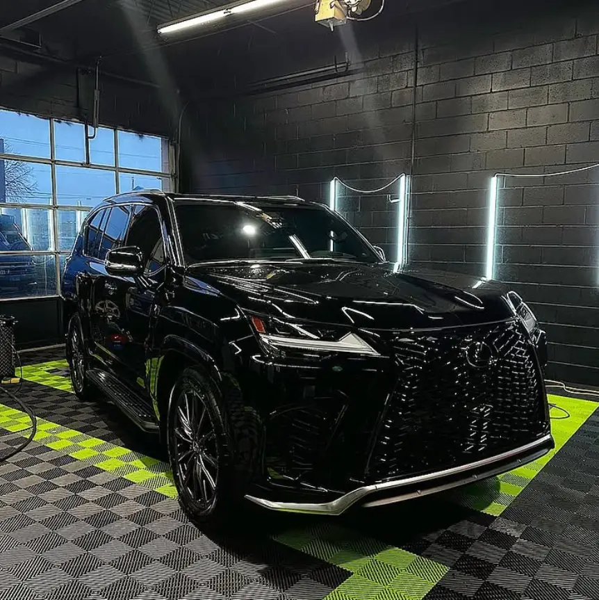 Black Lexus LX on the checker floor at Pro-Tint