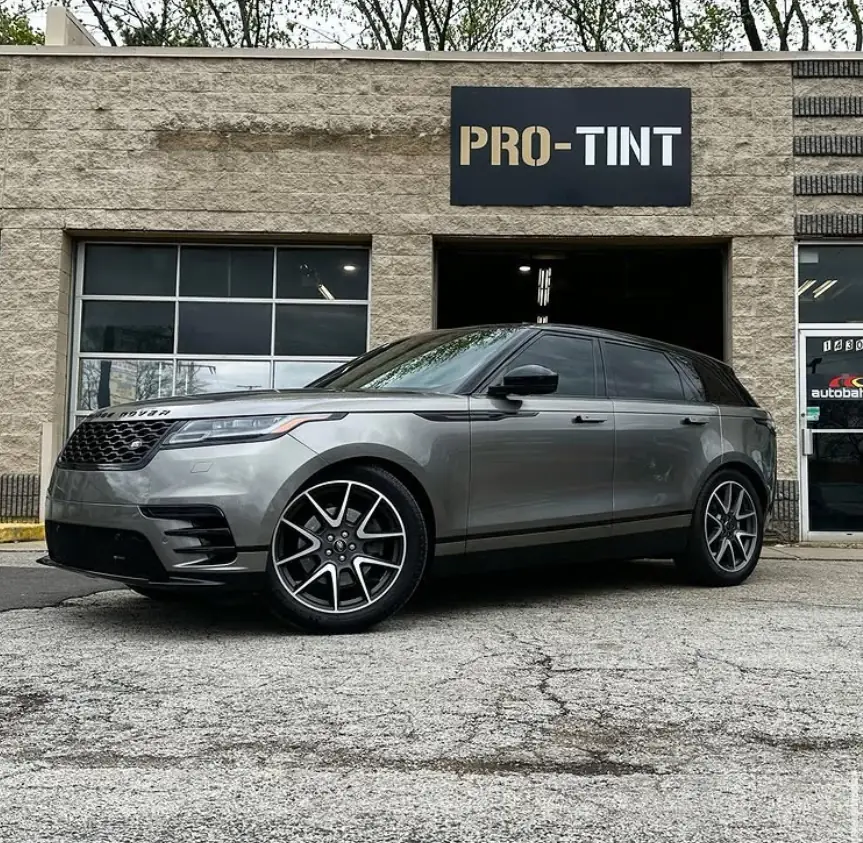 Gray Range Rover Velar outside the Pro-Tint sign