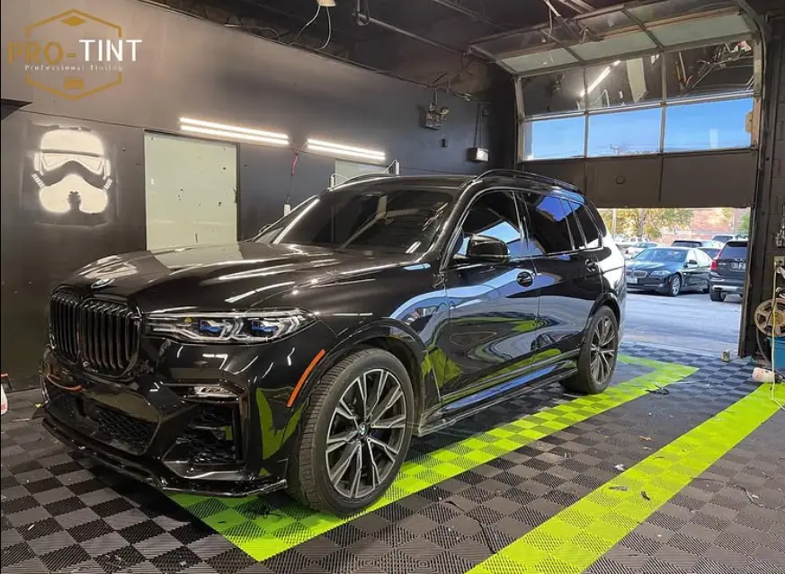 Black BMW X7 inside the Pro-Tint shop